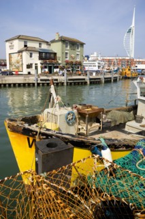 The Camber in Old Portsmouth showing the Spinnaker Tower behind the Bridge Tavern with its mural of