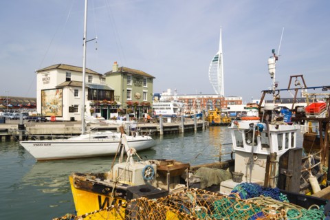 The Camber in Old Portsmouth showing the Spinnaker Tower behind the Bridge Tavern with its mural of