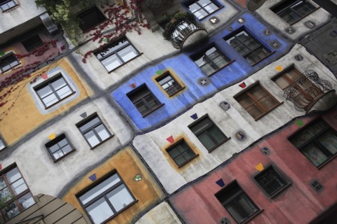 The Hundertwasser-Krawinahaus angled part view of exterior facade of apartment building. Photo :
