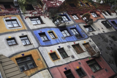 The Hundertwasser-Krawinahaus angled part view of exterior facade of apartment building. Photo :