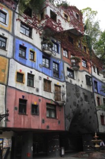 The Hundertwasser-Krawinahaus angled part view of exterior facade of apartment building. Photo :