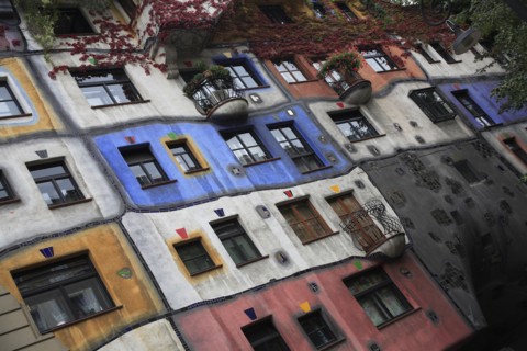 The Hundertwasser-Krawinahaus angled part view of exterior facade of apartment building. Photo :