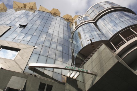 Exterior detail of the Haas Building or Haas Haus. Modern glass fronted and concrete office