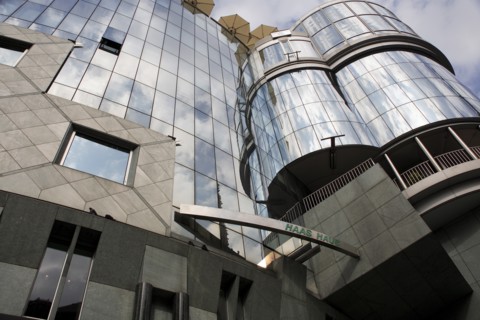 Exterior detail of the Haas Building or Haas Haus. Modern glass fronted and concrete office