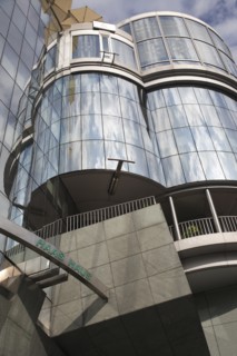 Exterior detail of the Haas Building or Haas Haus. Modern glass fronted and concrete office