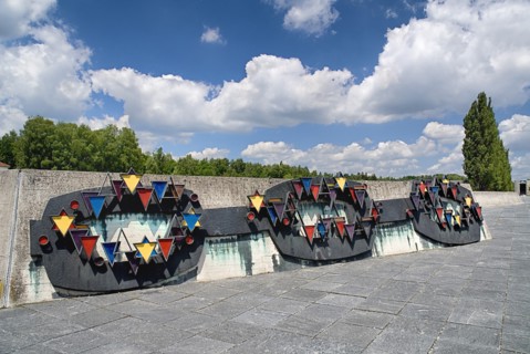 Dachau World War II Nazi Concentration Camp. Prisoner badges memorial Communists were given red