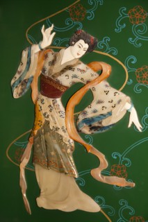 Painted jade carving of a Chinese woman on a piece of furniture. Photo: Mel Longhurst