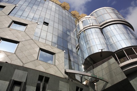 Exterior detail of the Haas Building or Haas Haus. Modern glass fronted and concrete office