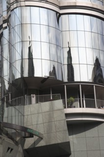 Exterior detail of the Haas Building or Haas Haus. Modern glass fronted and concrete office