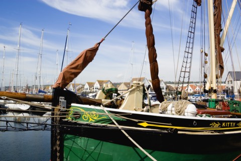 Port Solent Sailing barge SB Kitty moored in the marina with housing beyond. Photo : Paul Seheult