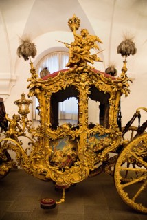 Nymphenburg Palace Marstall Museum. Highly ornate gold and painted coach made for the coronation of