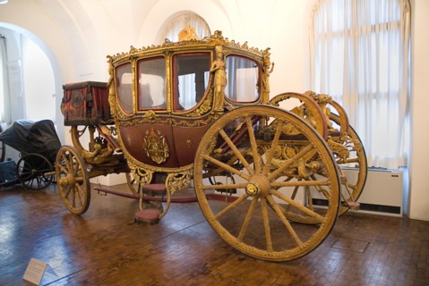 Nymphenburg Palace Marstall Museum. Highly ornate gold and painted coach made for the coronation of