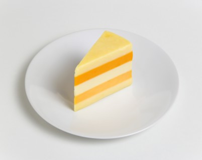 Slice of cheese comprised of five different British cheeses on a plate. Photo: Paul Seheult