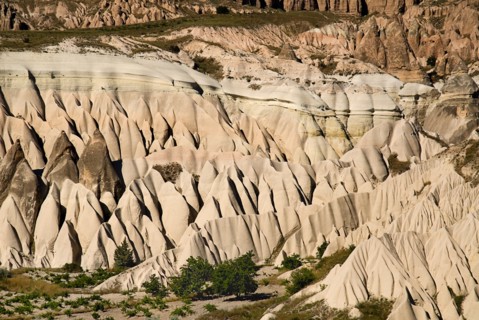 View across Rose Valley in foreground towards Red Valley behind with jagged eroded peaks of