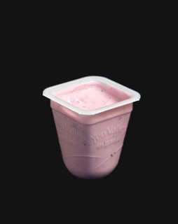 Yeo Valley probiotic blueberry fruit yogurt pot against a black background. Photo : Paul Seheult
