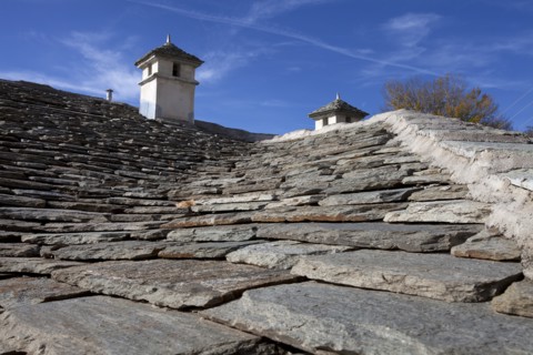Portaria Greek village house traditional roof with chimneys made from stone. Photo : Athanasios