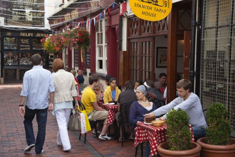 The Lanes people sat outside a Spanish Tapas restaurant. Photo: Stephen Rafferty