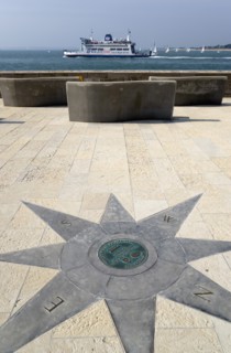 A plaque within a compass on the Millenium Walk commemorating its opening by Prince Phillip The