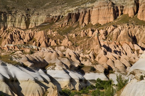 Rose and Red Valleys the Church of the Three Crosses. Rock cut cave church amongst ochre and white