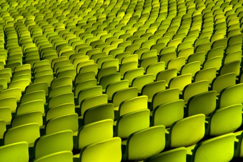 Olympic Stadium. Curved section of bright green seating in the stadium. Photo : Hugh Rooney