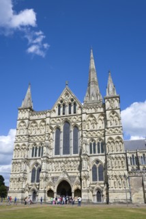People on the grass of the Close in front of the West Front main entrance of the 13th Century Early