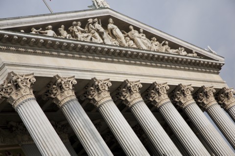 Parliament building. Detail of colonnaded entrance and carved pediment. Photo: Bennett Dean