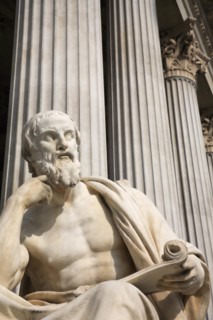 Statue of the Greek philosopher Herodotus in front of columns of the Parliament Building. Photo: