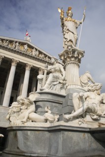 Statue of Athena raised on pillar above fountain in front of the Parliament building. Photo: