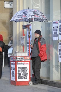Pipe smoking Evening Times newspaper street vendor. Photo: Steve Lindridge