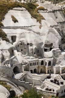 Cave hotel built into white tufa rock of hillside. Photo: Hugh Rooney
