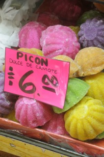 Mexico, Puebla, Markets, Coloured sweets for sale. 
Photo : Nick Bonetti