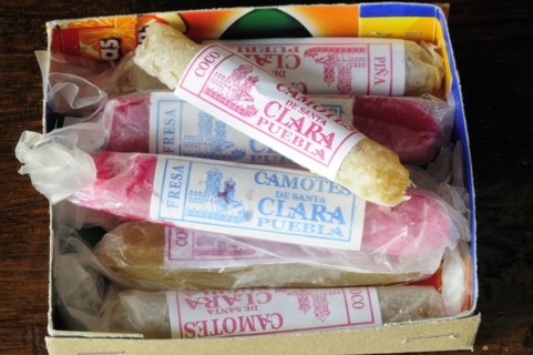 Mexico, Puebla, Markets, Sticks of camotes or candied yam. 
Photo : Nick Bonetti