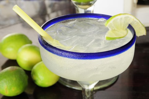 Mexico, Jalisco, Puerto Vallarta, Frosted glass of a margarita cocktail served with ice and slice