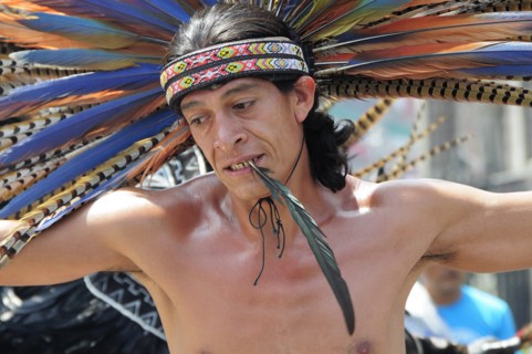 Mexico, Federal District, Mexico City, Michicoa Aztec dancer performing in the Zocalo. 
Photo :