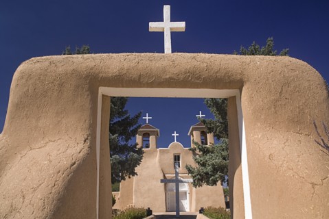 USA, New Mexico, Taos, Church of San Francisco de Asis. Entrance framing view to church exterior