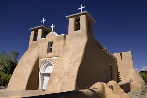 USA, New Mexico, Taos, Church of San Francisco de Asis. Angled view of adobe style exterior facade