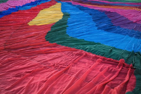 USA, New Mexico, Albuquerque, Annual balloon fiesta. Detail of colourful hot air balloon spread