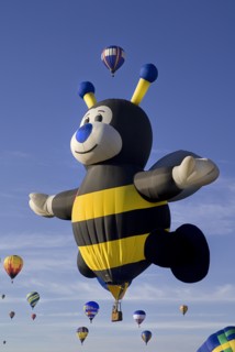 USA, New Mexico, Albuquerque, Annual balloon fiesta colourful hot air balloons ascending with