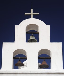 USA, Arizona, Tucson, Mission Church of San Xavier del Bac. White painted bell tower with three