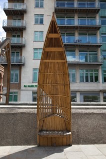 England, London, Vauxhall Albert embankment benches made from wood in the shape of boats. 
Photo :
