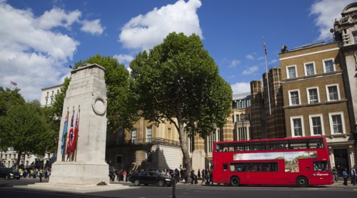 England, London, Westminster Whitehall the Cenotaph with protesters outside the Department for