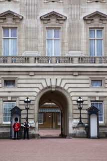 England, London, Westminster Buckingham Palace exterior with both Queens Guard and Metropolitan
