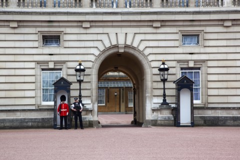 England, London, Westminster Buckingham Palace exterior with both Queens Guard and Metropolitan