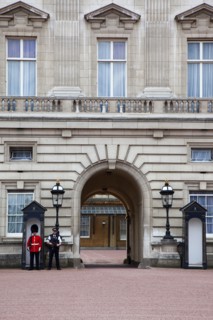 England, London, Westminster Buckingham Palace exterior with both Queens Guard and Metropolitan