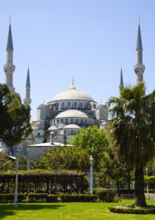 Turkey, Istanbul, Sultanahmet Camii The Blue Mosque with domes and minarets seen from the gardens.