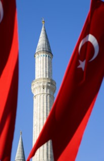Turkey, Istanbul, Sultanahmet Haghia Sophia minaret and Turkish red flag with white crescent moon