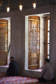 Turkey, Istanbul, Sultanahmet Camii Blue Mosque interior with men at worship. 
Photo : Stephen