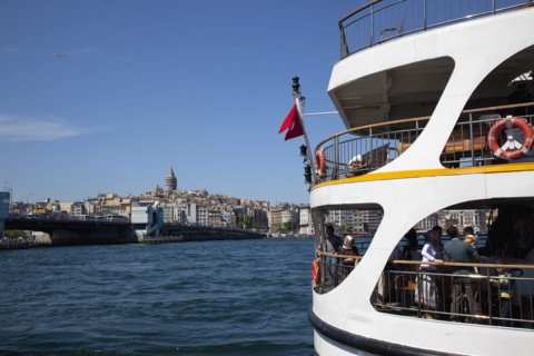 Turkey, Istanbul, Eminonu view across the Golden Horn toward Galata district. White ferry carrying