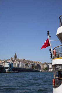Turkey, Istanbul, Eminonu view across the Golden Horn toward Galata district. White ferry carrying