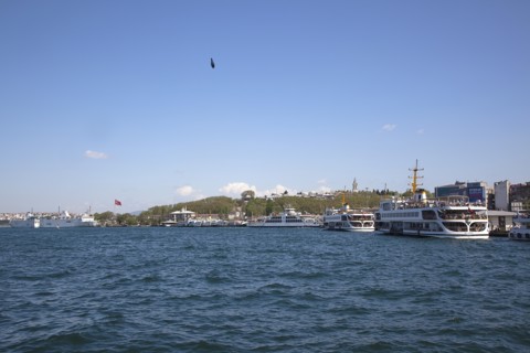 Turkey, Istanbul, Galata Bridge farries on Sirkeci quayside with fishermans line weight visible.